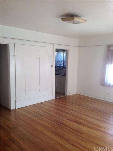 Murphy bed and door to kitchen
