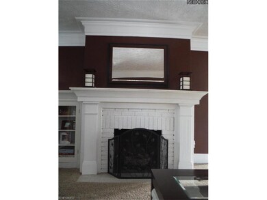 This charming fireplace area is home for gas logs 