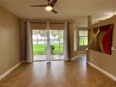 Spare room with a ceiling fan and a water view