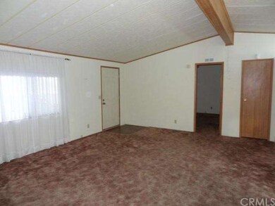 Spacious living room with cathedral ceilings. 