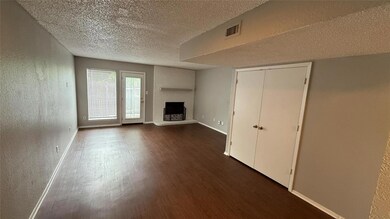 Unfurnished living room with dark wood-type floori