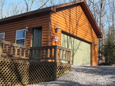 2 car garage with large deck and cement foundation