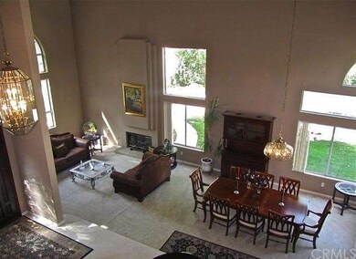 Soaring ceiling over the entryway, formal living r