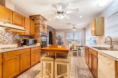 Eat in kitchen with gorgeous brick accent wall.