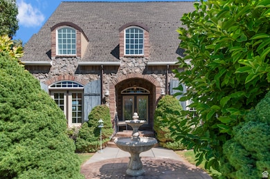 Doorway to property featuring stone siding