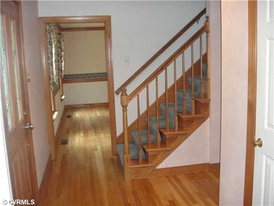 Foyer - Gracious foyer w/oak floors, mouldings, co
