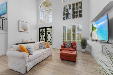Living room with light wood-type flooring and a hi
