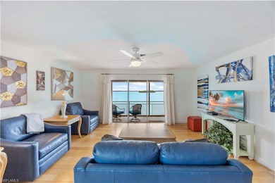 Living area featuring light wood-type flooring and ceiling fan