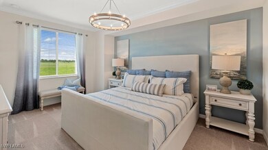 Bedroom with light colored carpet, a chandelier, a