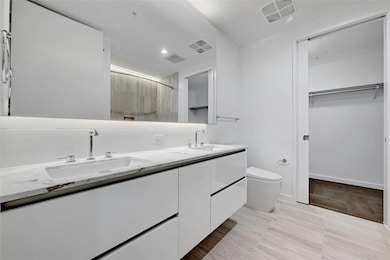Full bathroom featuring a sink, visible vents, to