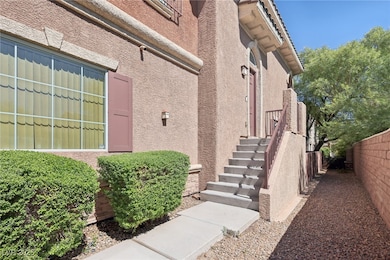 Entrance to property featuring stucco siding