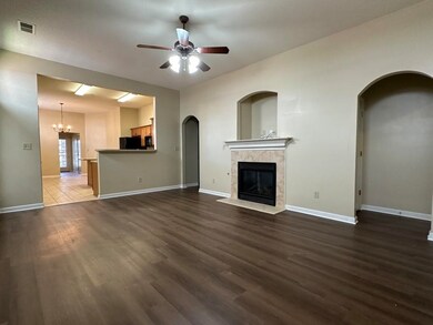 Unfurnished living room with a tile fireplace, cei