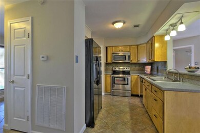 Kitchen Features Corian Countertops, New Sink and