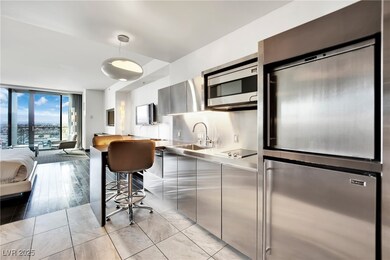 Kitchen with expansive windows, modern cabinets, s