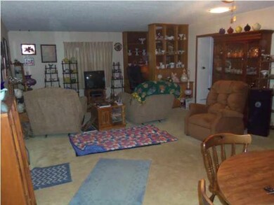 Living room/dining room with built-in office area