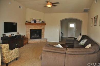 Living room with vaulted ceiling, gas fireplace, a