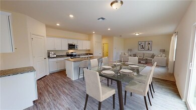 Dining room with light hardwood / wood-style flooring