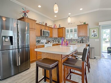 NEW 4-DOOR REFRIGERATOR AND NEW MICROWAVE.