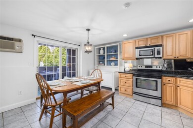 Large eat in kitchen with sliders to patio and cus