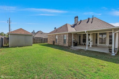 View of yard with a patio and an outdoor structure