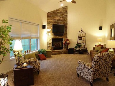 Great Room. The living room has soaring vaulted ce