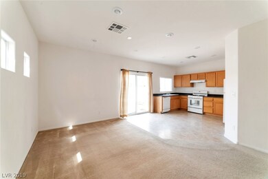 Family room and kitchen. Sliding glass door for ba