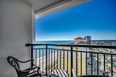 Balcony with a water view, a view of city, and a b