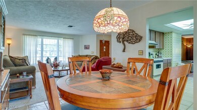 Dining area with a slider leading to large lanai