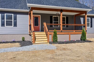 Property entrance with a shingled roof and covered