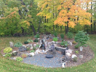 Tranquil, wooded backyard: complete with fire pit 