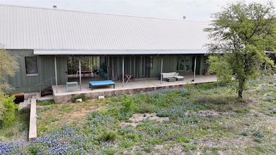 Rear view of property featuring board and batten 