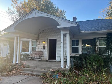 View of exterior entry featuring covered porch