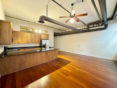 Kitchen with ceiling fan, hardwood / wood-style fl