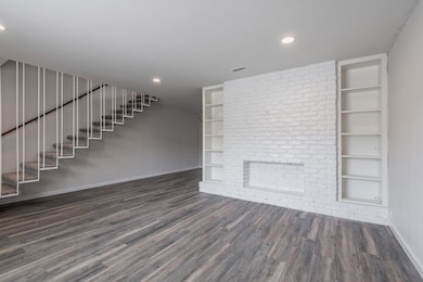A rare two story unit with a unique floating staircase. The first floor living area measures ~15x15 feet. Fireplace is decorative.