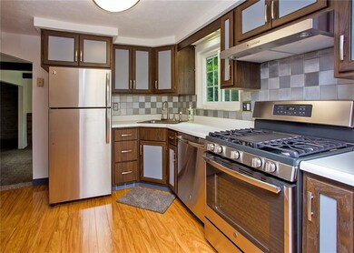 Beautiful eat-in kitchen with laminate flooring.