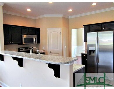 Kitchen. Tons of Cabinets accented with granite co