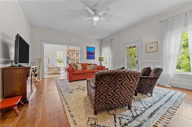 Living room on first floor of the main house which leads to the sitting room.