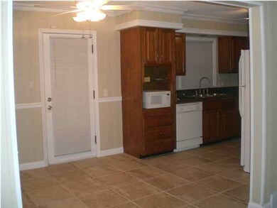 Kitchen is adjacent to dining area.