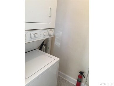 Laundry. Stacked in-unit washer and dryer just off