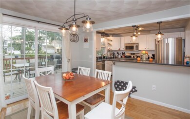 Dining area facing deck and kitchen