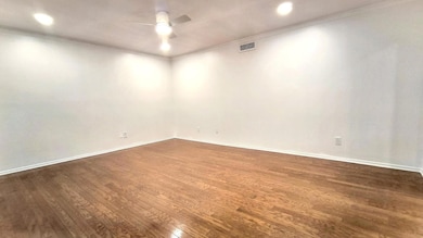 Spare room with dark wood-type flooring, ornamenta