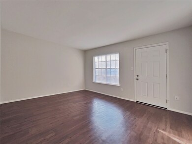 Another view of the living area and entry.