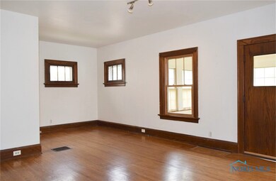 Features beautiful hardwood floors and a wood burn