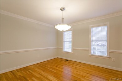 The Dining Room features chair rail and ceiling mo