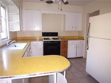 Kitchen. ANOTHER VIEW OF THE KITCHEN SHOWING THE C