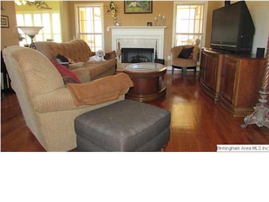 Beautiful hardwood floors grace the great room.  B