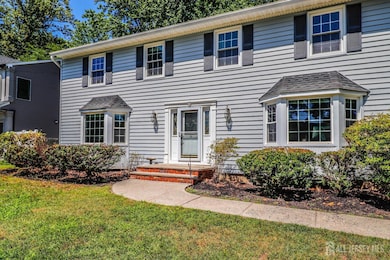 colonial inspired home with a front yard