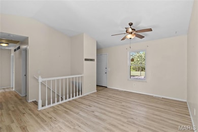 Unfurnished room featuring light wood-type flooring and ceiling fan