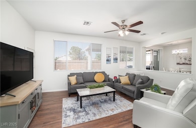 Living area featuring a chandelier, dark wood-styl