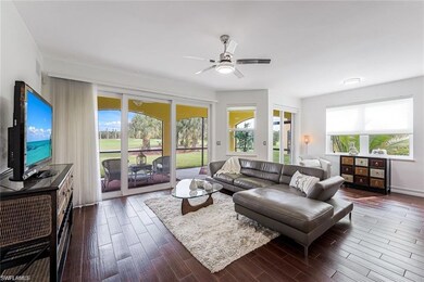 Living room with cherry tile plank flooring throughout